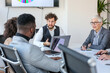 © Sanja - A group of business partners sit in a conference room and agree on new business contracts, the boss proposes new amendments