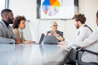 © Sanja - A group of business partners sit in a conference room and analyze the business and profits of their corporation