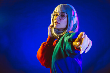 Young woman with grey hair dancing and celebrate. Colored gel portraits