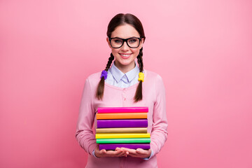 Canvas Print - Portrait of her she nice attractive pretty lovely cute content cheerful intelligent girl geek holding in hands pile stack book isolated over pink pastel color background