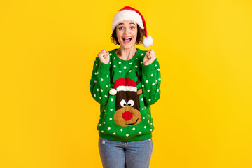 Crazy astonished girl celebrate x-mas christmas party lucky gift raise fists wear santa claus headwear reindeer decor sweater pullover isolated bright shine color background