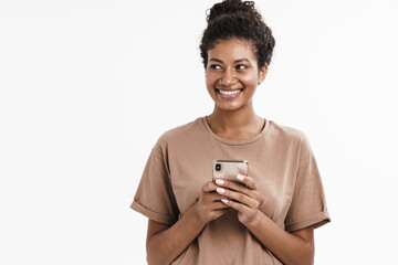 Wall Mural - Young african girl using mobile phone