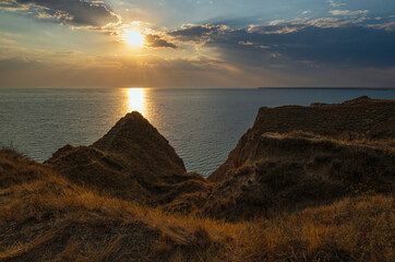 Wall Mural - picturesque sunset landscape of stanislav clay mountains and canyons above dnipro river bay near the