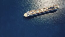 Stunning Top Down Shot In 4k Of Cruise Ship MSC Orchestra In Calm Blue Water - 4k Drone Footage - Amazing View In UHD - Mediterranean Sea
