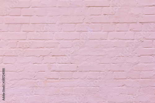 Old dusty pink stucco brick wall.