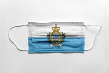 Wall Mural - Face mask with San Marino flag printed, on white background, isolated