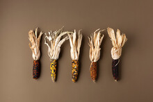 Creative Autumn Layout Made Of Corn On Brown Background. Fall, Thanksgiving Day Concept. Flat Lay, Top View, Copy Space.
