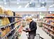 © lado2016 - Man shopping in supermarket, reading product information