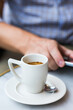 © aamulya - Businessman sitting in cafe, drinking morning coffee and using smartphone