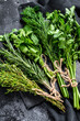 © Vladimir - Organic fresh herbs coriander, rosemary, thyme, dill, parsley. Black background. Top view