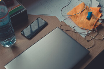 desk with a computer and a phone