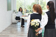 © New Africa - Schoolgirls with bouquet congratulating their pedagogue in classroom. Teacher's day