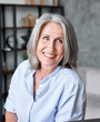 © insta_photos - Happy beautiful elegant old adult business woman smiling looking away in office. Positive stylish classy grey-haired middle aged mature female teacher, manager, entrepreneur or coach portrait.