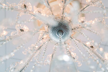Close-up Of A Chandelier That Is Illuminated.