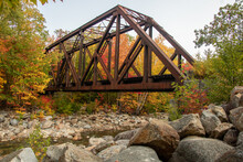 Railway Steel Bridge On A River During Autumn Season