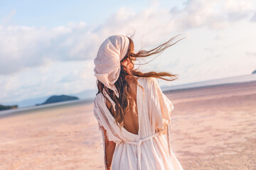 Wall Mural - beautiful young stylish woman outdoors at sunset