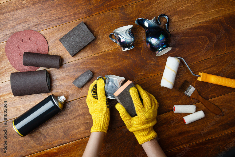diy a cup into a flower pot. Process of renovation and repainting of a ...