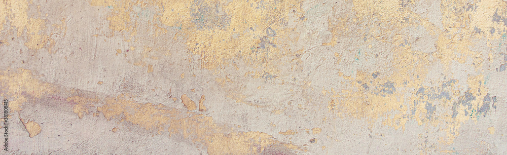 Old cracked weathered painted wall background texture. Yellow dirty peeled plaster wall with falling off flakes of paint. Abstract grunge uneven surface with scratches and cracks - obrazy, fototapety, plakaty 