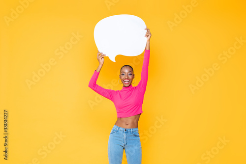 Cuadros en Lienzo Smiling beautiful African American woman raising empty speech bubble isolated on