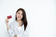 © Orathai - The hand of an Asian woman holding a credit card is used for online shopping and Internet payments