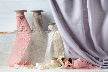 Wall Mural - Handmade linen laces trims on wooden spools.