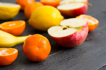 Wall Mural - Fruits on black wood table