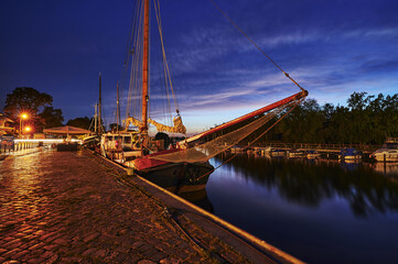 Sticker - GREIFSWALD, GERMANY - Aug 30, 2020: View of the Greifswald sailing harbor at the blue hour.