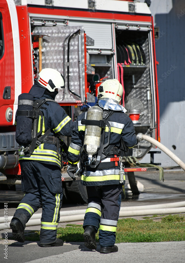 Firefighter at the scene of a fire Stock Photo | Adobe Stock
