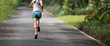 Fitness woman runner running at summer park trail . Healthy fitness woman jogging outdoors.
