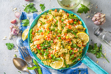 fusilli pasta with grilled roasted grilled vegetables. Warm pasta salad, vegan dinner food idea