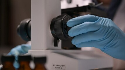 Wall Mural - scientists are working on research with microscope in term of medical science dna and covid-19 coron