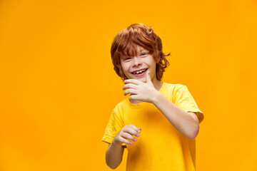 Wall Mural - Gone are the red-haired boy in a yellow T-shirt 