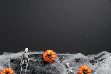 Dark halloween background with pumpkins, skeletons, spiders, web. Halloween party invitation card mockup.