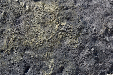 Wall Mural - Aerial view of a cracked landscape of earth, rock, and sulfur with relief and holes. Artistic texture background.