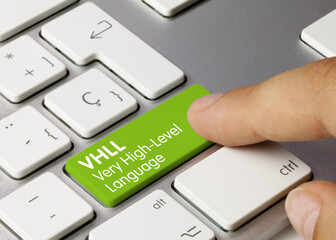 Wall Mural - vhll very high-level language - inscription on green keyboard key.