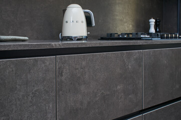 SMEG electric kettle on the stone countertop of the kitchen