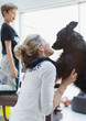 © Paul Bradbury/Caia Image - Affectionate woman with dog