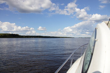 Wall Mural - Beautiful European river landscape, calm water and blue sky with white clouds on forest line on Horizon background at summer day, tranquilty relax photo picture, scenery view from yacht deck railing