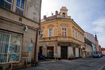 Colorful historical buildings in classicist style in the center of Duchcov in sunny day. Duchcov, Northern Bohemia, Czech Republic