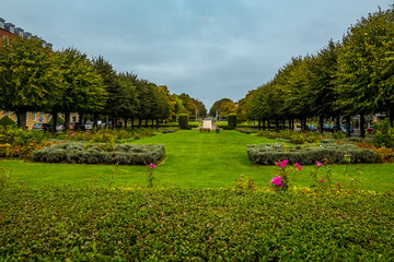 A view down the central green belt in Welwyn Garden City, UK in the summertime