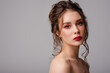 © Victoria Fox - Beauty portrait of young beautiful brunette woman with colorful makeup: pink, red eyeshadow, bold lipstick, elegant hairstyle. Copy, empty space for text