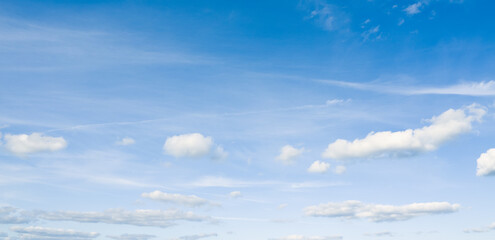 Wall Mural - Panoramic photo of beautiful light blue sky and white clouds.