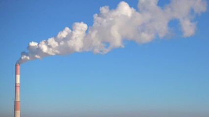 Wall Mural - Smoke from the chimney of factory and clear blue sky.