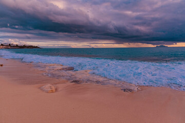 Sticker - Saint Maarten, Caribbean - January 18 2020:
  Caribbean beach of Saint Maarten island at sunset