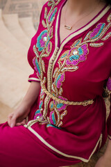 Moroccan traditional dress, embroidery on the caftan. Festive women's clothing in Morocco