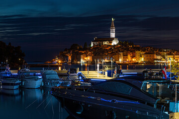 Picture of the illuminated historic part of Rovinj at night