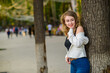 Portrait of young beautiful woman in the park outdoor