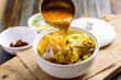 Northern Thai food (Khao Soi), Spicy curry noodles soup with chicken cooking in a bowl