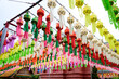 Colorful paper lanterns Lanna style hanging for worship or respect of buddha in Wat Phra That Hariphunchai, northern of Thailand