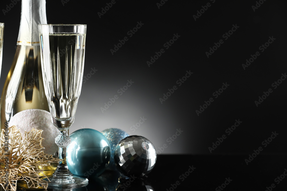 New Year composition with champagne on dark background